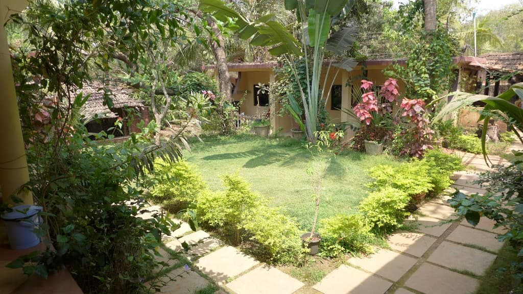 Lush garden paths and greenery at Zenobia Leisure, Anjuna